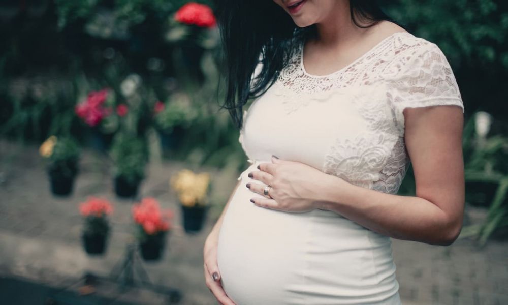 Consequences Of A Baby Passport In Uae Without Marriage | Consequences Of A Baby Passport In Uae Without Marriage | If You'Re Unmarried Or Single And Residing In The Uae, Being Pregnant Was Strictly Prohibited. In The Event That Local Authorities Discover That A Single Woman Is Pregnant, She Will Be Either Deported Or Threatened With Jail Time. Some Instances Involved Physical Punishment Or Lashings. However, These Occurred Only Rarely And In Very Extreme Circumstances. A couple holds hands while standing in front of an iconic Dubai skyline symbolizing love and commitment. The scene is bright and cheerful with palm trees lining a walkway, showcasing a beautiful outdoor setting perfect for weddings.