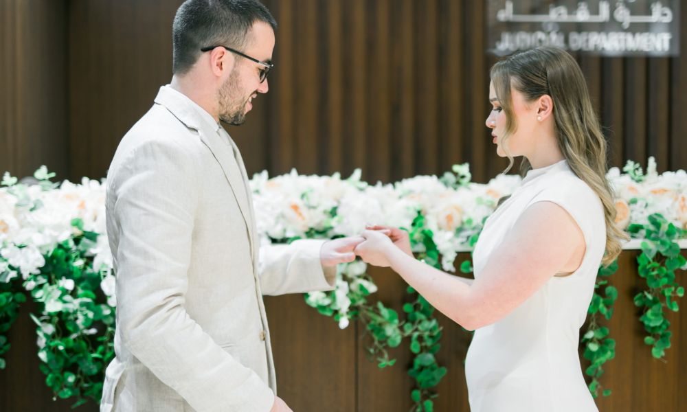 25.08.13 Michelle Krugel Jack EWD to share 18 scaled | Can’t Find Marriage Slots in Dubai? Why Abu Dhabi Is Your Only Fast Option | When couples search for marriage slots in Dubai, they are usually looking for a fast and straightforward legal process. But in many cases, the issue is not availability it is that the process itself does not fit their timeline or eligibility. Couple completing civil marriage in Abu Dhabi court as an alternative to Dubai marriage slots