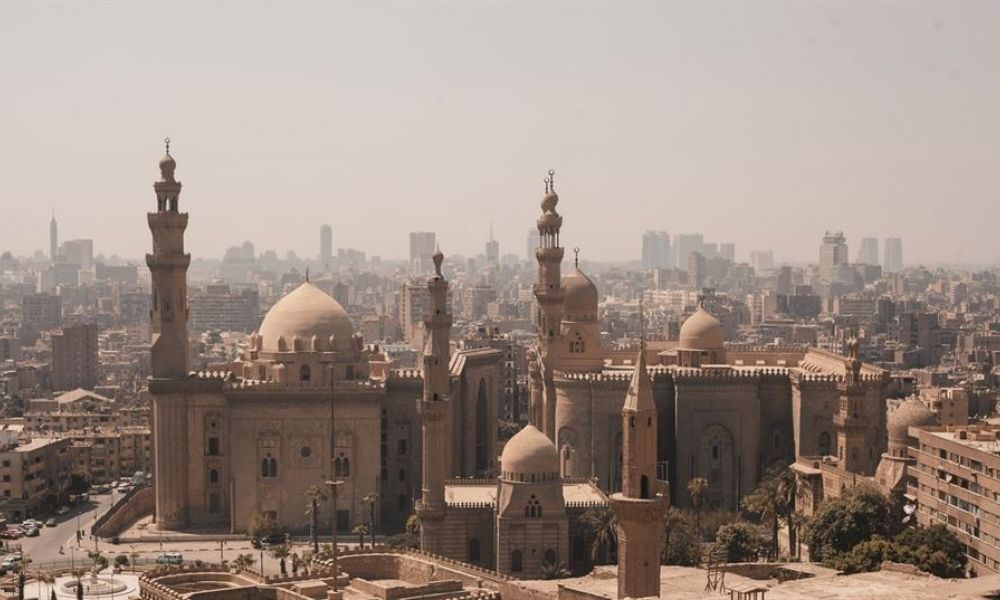 Easy Guide For Egyptian And Filipino Marriage In Dubai | Easy Guide For Egyptian And Filipino Marriage In Dubai | Just Like Other Places, Dubai Has Its Own Set Of Processes That You Need To Fulfill To Get Married. Additionally, You Can Plan Your Dream Wedding Depending Upon Your Religion, Residency Status, And Nationality. It Can Also Alter The Straightforward Process To A Complex And Time Consuming One. This Article Discusses The Most Important Requirements And Guidelines For Egyptian And Filipino Marriages In Dubai. A warm panoramic view of Dubai showcasing a mix of historic buildings and modern skyscrapers under soft sunlight. The foreground features impressive Islamic architecture with tall minarets and large domes. The expansive skyline captures the vibrant spirit of the bustling city, making it ideal for celebrating love through weddings, ceremonies, and memorable moments.