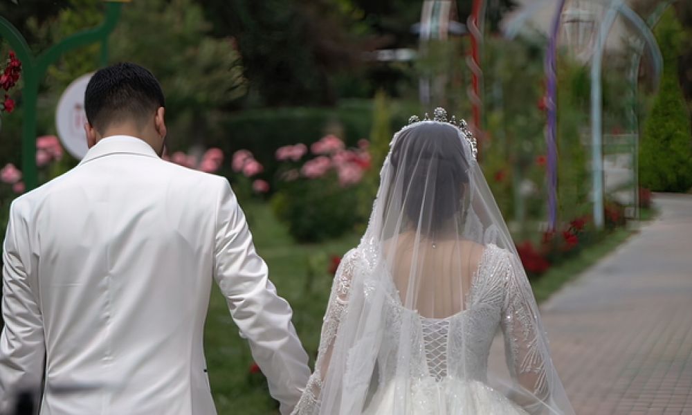 640 The Bride And Groom Are Walking In The Park On Their Wedding Day 5D90B1Ad | Emirati Weddings: Can Emiratis Marry Expats In Uae In 2024? | Georgia Has The Easiest Pathway To Get Married If You Are An Emirati Looking To Marry An Expat. Emirati Weddings: Can Emiratis Marry Expats in UAE in 2024?