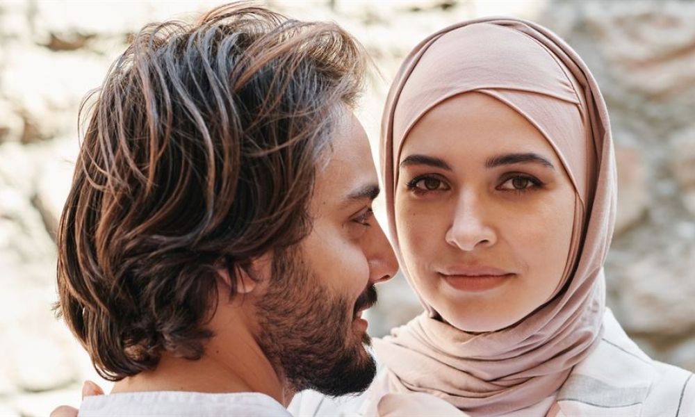 Getting Married In Seychelles Is It Possible To Hold A Muslim Wedding Abe8868E | Getting Married In Seychelles ? Find Out If Its Possible To Hold A Muslim Wedding | Are You A Muslim And Want To Know If You Can Getting Married In The Seychelles; Is Even Possible? Then Yes, A Muslim Marriage In The Seychelles Can Take Place For Dubai Residents. A happy couple smiling together as they plan their wedding in Dubai surrounded by stunning scenery and decorations, showcasing love and excitement for their special day. They are exploring various options like civil marriage and online registration while enjoying the outdoor atmosphere typical of Dubai events.