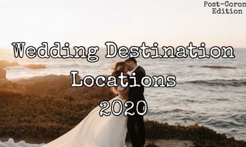 4E5Ffa2B | Destination Wedding Trends 2020. (Post-Corona Edition). | Destination Weddings’ Popularity Is Increasing Every Day. What Else Can Help You To Create A Unique Wed Experience At The Amazing Location Better Than That; Together With Your Family And Friends Or As A Secret Elope Of You Two. A stunning outdoor wedding scene featuring a bride in an elegant white dress and a groom in a dark suit. They are embraced against a picturesque backdrop of the sea at sunset, creating a warm golden glow. The image is enhanced with text reading Wedding Destination Locations 2020 and Post-Corona Edition, suggesting it as an ideal location for couples wishing to celebrate their love amidst natural beauty. The ambiance exudes romance and warmth perfect for weddings.